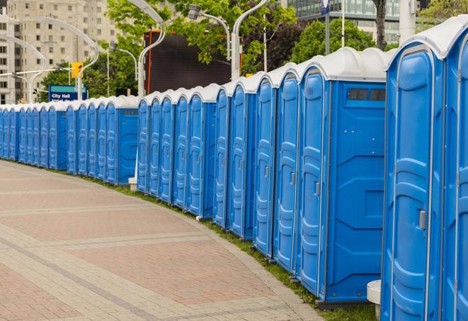 a row of portable restrooms at a fairground, offering visitors a clean and hassle-free experience in hopkinton